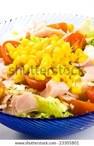 salad with lettuce, corn, tomato and ham