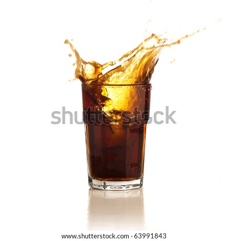 beverage splash into a glass on white background