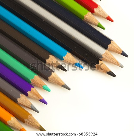 closeup of different crayons on a white background
