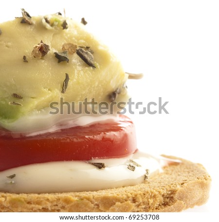tomato, avocado and  bread appetizer snack on white