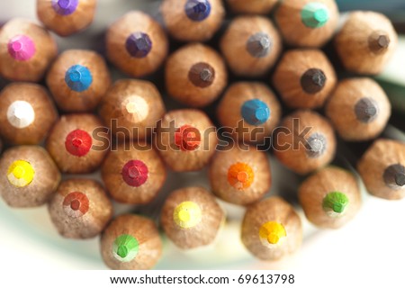 extreme closeup of a various crayons on white background