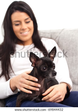 girl with dog resting on a sofa