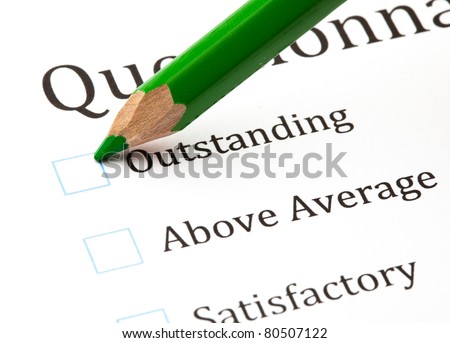 questionnaire check boxes and green crayon closeup