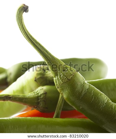 red and green chilli peppers on a white background