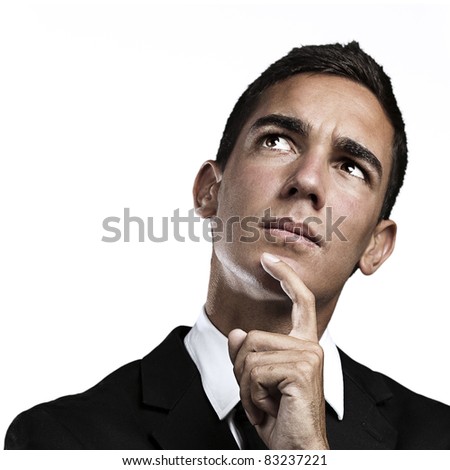 Closeup of a handsome young business man thinking about copy-space against white background