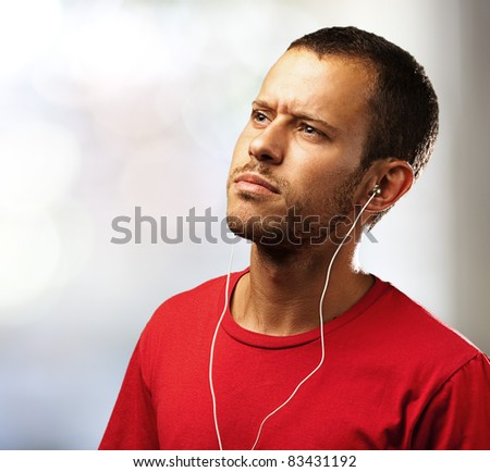 young man listen to music at home