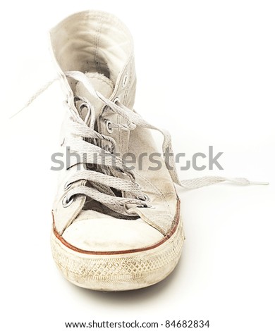 vintage age-worn sneakers on a white background