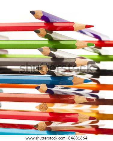 wooden crayons tower on a white background