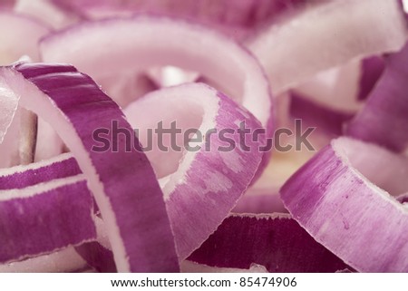 purple onion slices pile, extreme closeup photo