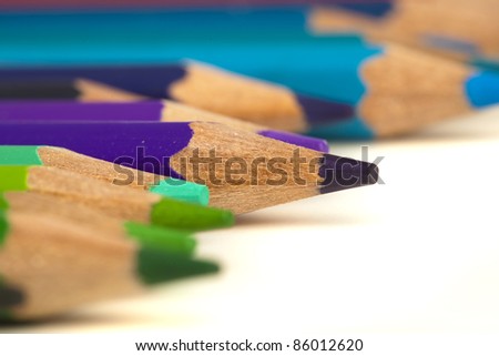 closeup of various crayons on a white background