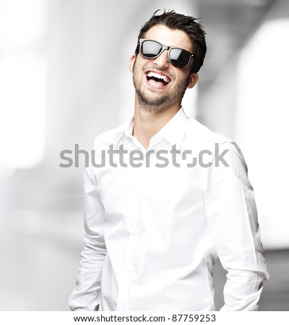 portrait of handsome young man smiling indoor