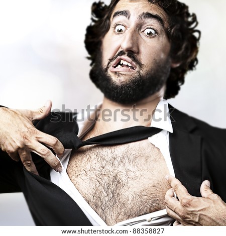 business man with courage and superman concept tearing off his shirt isolated over white background