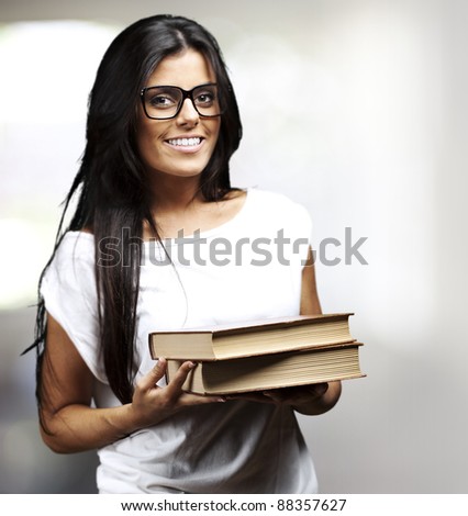 portrait of young student holding books indoor