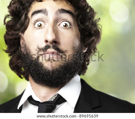 portrait of young man afraid against a plats background