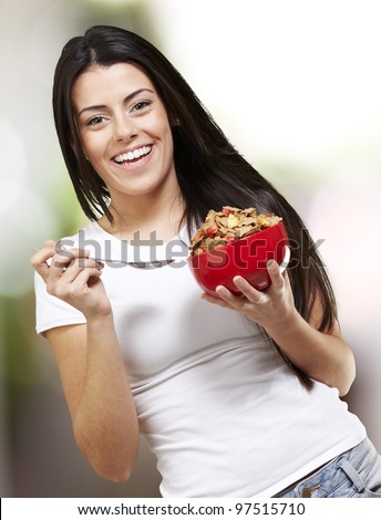 woman holding a delicious red breakfast bowl, outdoor