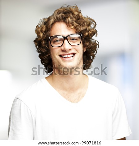 portrait of a handsome young man smiling indoor