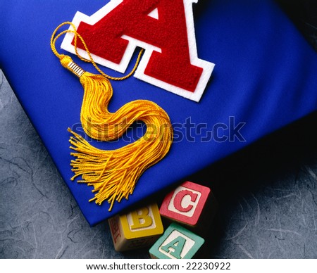 Mortar board with tassel and ABC blocks