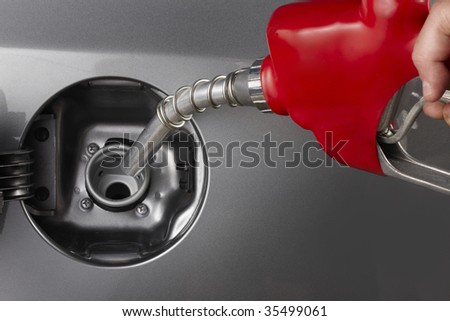 Gas attendant fills car with gasoline
