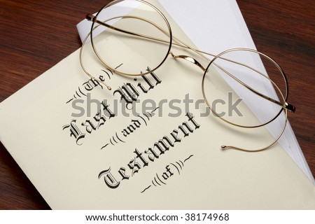 Last will and testament, wire rim glasses shot on warm wood surface