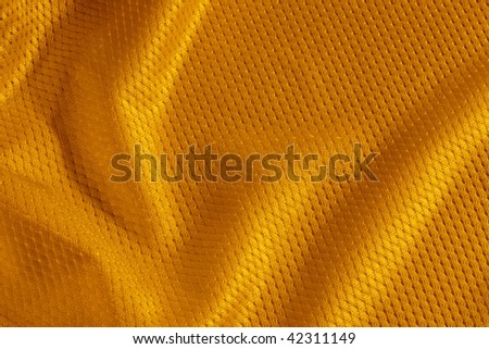Close up shot of orange textured football jersey