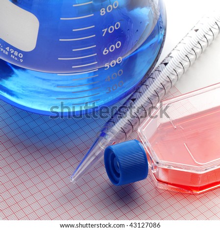 small bottles and medical supplies shot on graph paper