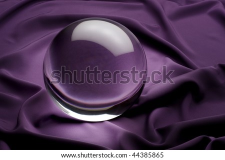 glowing crystal ball shot on purple satin