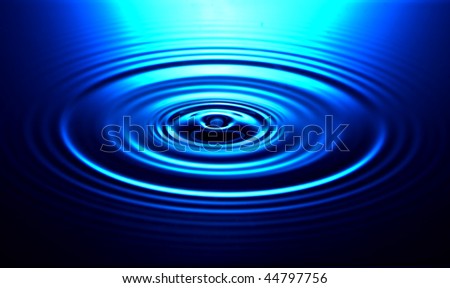 Drip causes ripple in water with concentric circles