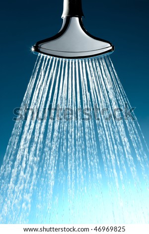 Chrome sprinkler head with water coming out at high pressure