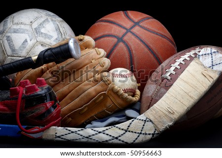 Close up shot of old soccer ball, basketball, baseball, football, bat, hockey stick, baseball glove and cleats