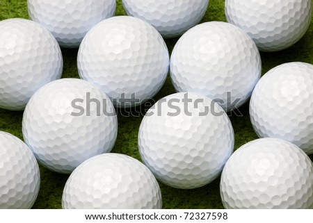 Macro shot of golf ball on putting green, can be used as background