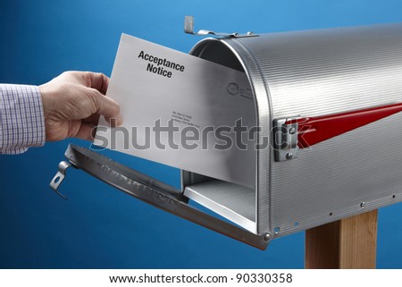 Man takes Acceptance Notice out of an open mailbox