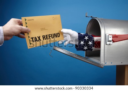 Uncle Sam's arm comes through mailbox to give/take tax refund, includes space for copy