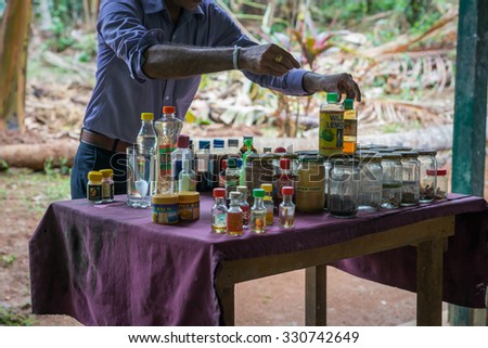 Sri Lanka. Kandy - August 16, 2015. The Spice Garden. The Man shows spices and Ayurvedic oils.