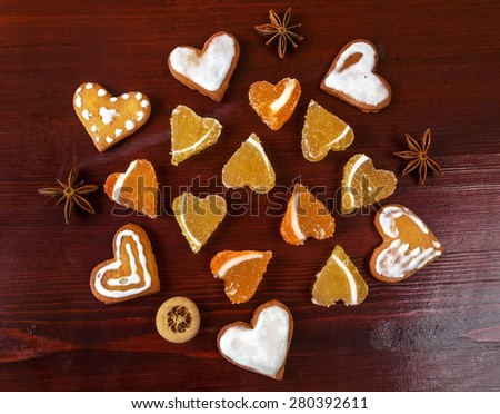 Colored jelly and biscuits on a wooden background