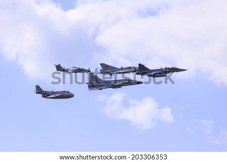 RONNEBY F17, SWEDEN - JUNE 01: A unique image of five generations swedenbuilt fighters (1950-2014) in the air at the airshow of Swedish Air force in Ronneby F17 Sweden, June 01 2014