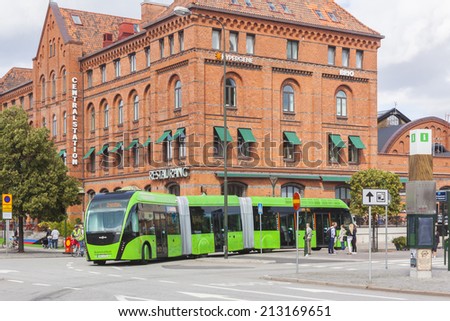 MALMO, SWEDEN - AUGUST 20, 2014: The new tall bus is a new power in the public transport to save the environment. Here in front of the old Centralstation in Malmo Sweden.