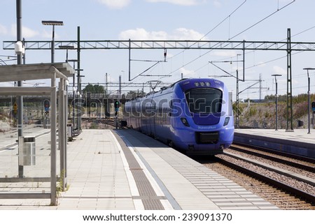 MALMO, SWEDEN - JULY 07, 2013:  Local trains at the station of the new mall, Emporia, close the bridge of Oresund and with connection to Copenhagen, Denmark.