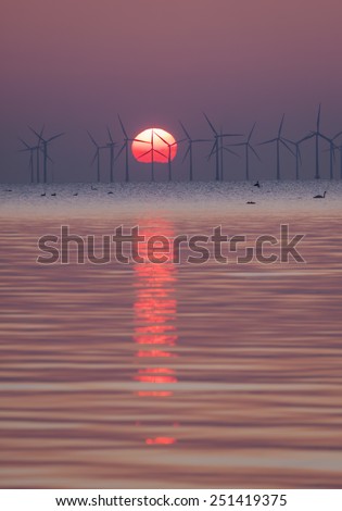 Two kinds of clean energy, sun and a offshore wind farm