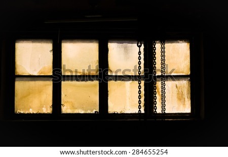 Abstract work with old windows on locked industry plant
