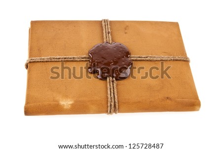 old book with seal wax isolated on white