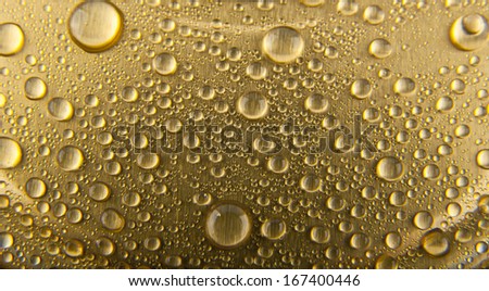 drops of water on a gold background