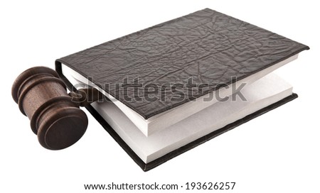 a wooden mallet and a book on a white background