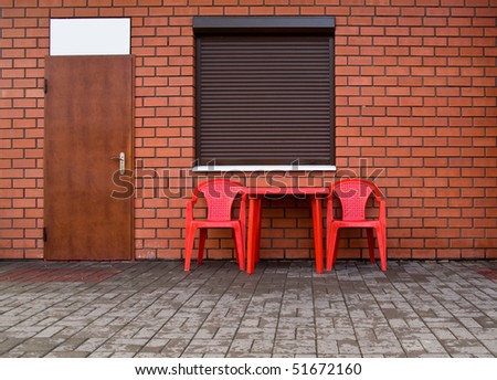 wall from a red brick, by a window, door and chairs for your illustrations