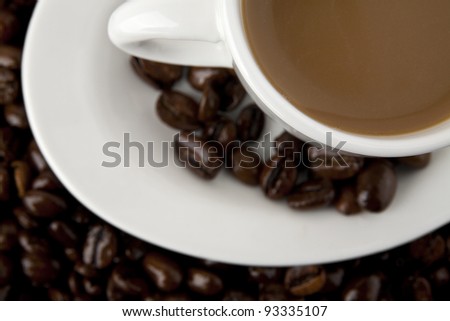 cup of coffee on the background of the coffee beans