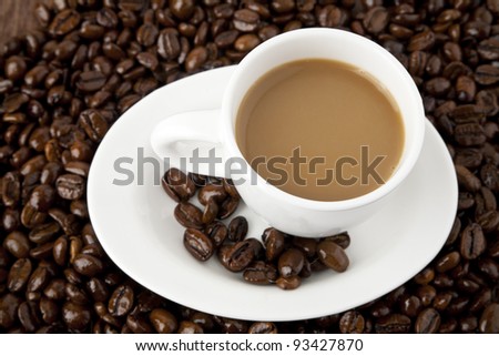 cup of coffee on the background of the coffee beans