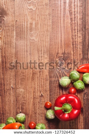 Composition of veggies on wooden table surface