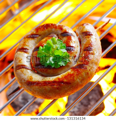 Smoking Flaming Rolled Sausage in a close up shot