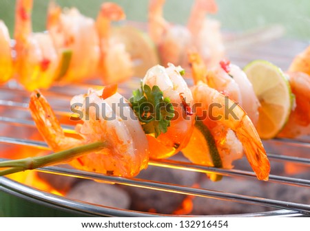 Close up view of Mexican grilled shrimp on stick