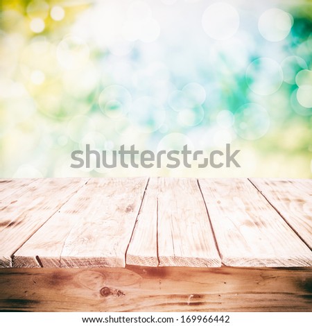Old Weathered Cracked Wooden Table In A Sunny Summer Garden With A High Key Background, Low Angle With Space For Product Placement