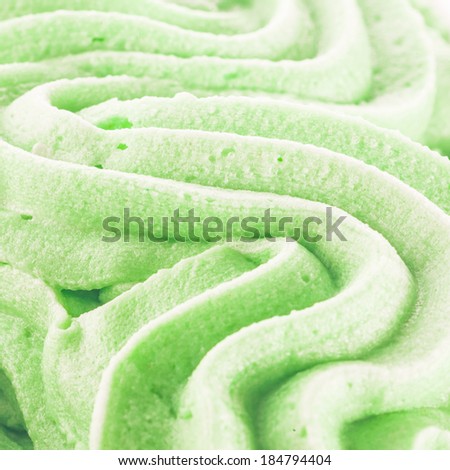 Background texture of cool refreshing swirled green Italian ice cream for a creamy delicious summer treat
